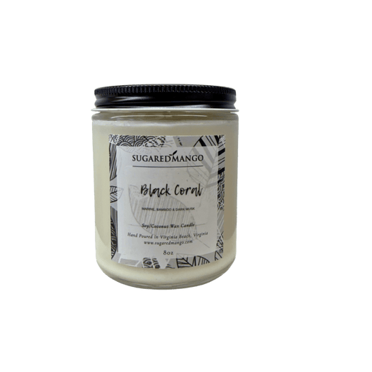 Candle jar labeled 'Black Coral' by Sugared Mango on a white background