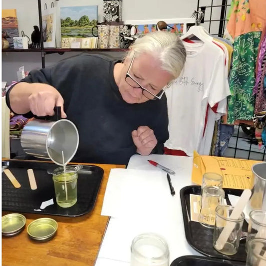 “Virginia Beach candle class at Sugared Mango – person pouring a candle"