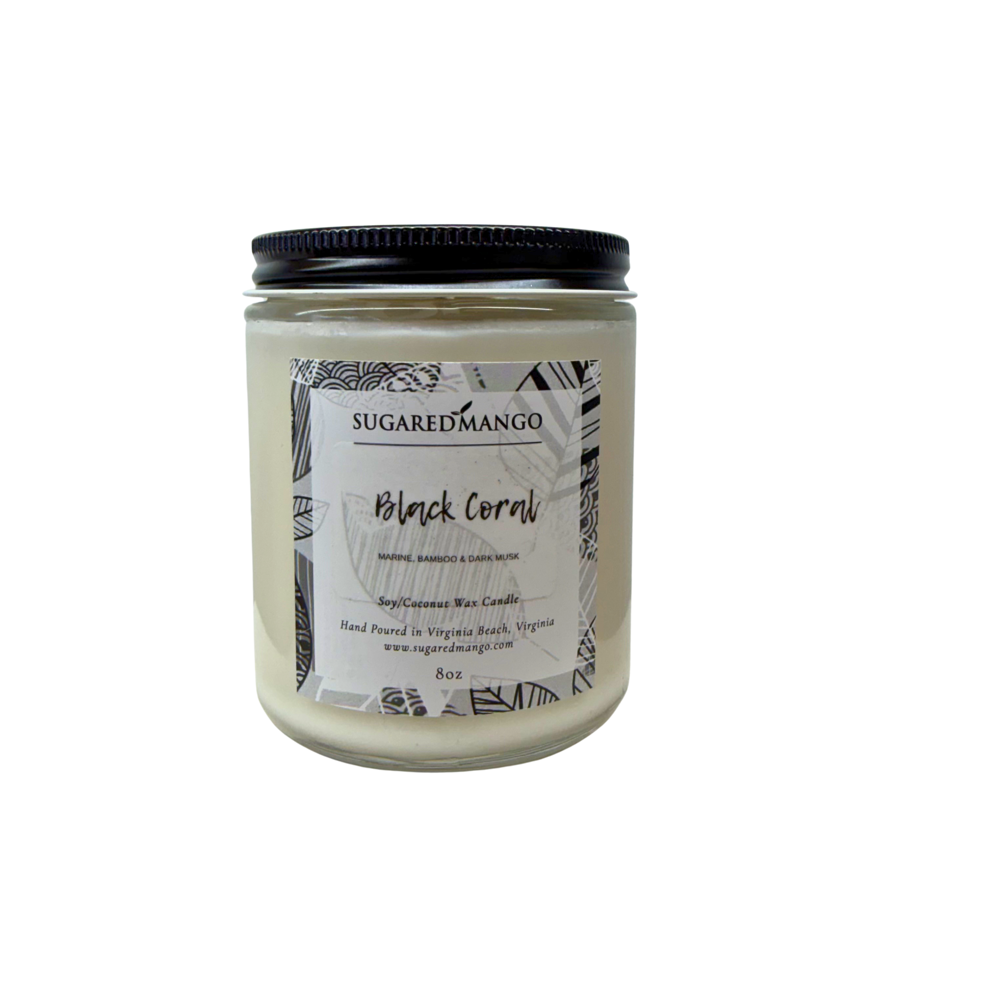 Candle jar labeled 'Black Coral' by Sugared Mango on a white background